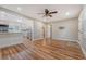 Spacious living room with wood flooring, seamlessly connecting to a modern kitchen, designed for comfortable living at 4546 Holly St, North Charleston, SC 29405