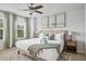 Comfortable bedroom featuring a ceiling fan, a bright window, and stylish decor at 4557 Mixson Ave, North Charleston, SC 29405