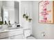 Bathroom features a white vanity with sink, toilet, and hanging plant decorations at 4585 Summey St, North Charleston, SC 29405