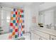 Bright bathroom with colorful shower curtain, vanity, and a modern design at 4585 Summey St, North Charleston, SC 29405