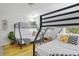 Bright bedroom with bunk beds, and a yellow patterned rug, perfect for children at 4585 Summey St, North Charleston, SC 29405