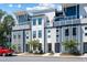 Contemporary townhome exterior featuring modern design and neutral color palette at 4585 Summey St, North Charleston, SC 29405