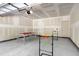 Spacious garage with ping pong table and other games; door and ceiling unfinished at 4585 Summey St, North Charleston, SC 29405