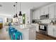 Open kitchen layout with a large island, modern appliances, and a seamless flow to the living area at 4585 Summey St, North Charleston, SC 29405