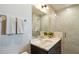 Contemporary bathroom with a tiled shower, marble-style walls, and a modern vanity sink at 5 Gadsdenboro St # 204, Charleston, SC 29401