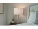 Bedroom nightstand with lamp and decorative elements at 5 Gadsdenboro St # 204, Charleston, SC 29401