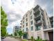 Stylish apartment complex exterior showcases modern design, balconies, and lush landscaping at 5 Gadsdenboro St # 204, Charleston, SC 29401