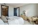 A beautifully decorated bedroom featuring modern furniture, neutral colors, and natural light at 5 Gadsdenboro St # 204, Charleston, SC 29401