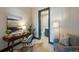 Inviting home office with a desk, a comfortable chair, and a peek into a serene bathroom at 5 Gadsdenboro St # 204, Charleston, SC 29401