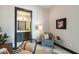 Stylishly decorated office space with neutral tones and a glimpse into the adjacent bathroom at 5 Gadsdenboro St # 204, Charleston, SC 29401