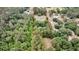 Secluded property featuring a charming home surrounded by lush, mature trees within defined lot lines at 5056 Red Oak Rd, Cottageville, SC 29435
