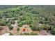 Aerial shot of a home with a small lot, with views of the dense trees and open sky, highlighting rural serenity at 5056 Red Oak Rd, Cottageville, SC 29435