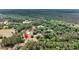 Expansive aerial view of a home nestled among dense trees and lush greenery, offering privacy and a serene setting at 5056 Red Oak Rd, Cottageville, SC 29435