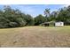 Open backyard with large shed at 5056 Red Oak Rd, Cottageville, SC 29435