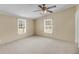 Bedroom featuring neutral walls, plush carpet, large windows and a ceiling fan at 5056 Red Oak Rd, Cottageville, SC 29435