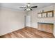Bedroom with wood-look flooring, blue accent furniture, and a ceiling fan at 5056 Red Oak Rd, Cottageville, SC 29435