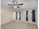 Bedroom featuring two windows providing lots of natural light and ceiling fan at 5056 Red Oak Rd, Cottageville, SC 29435