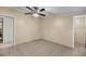 Bedroom with a ceiling fan, a beige carpet, and a walk-in closet at 5056 Red Oak Rd, Cottageville, SC 29435