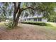 A single story house with a cozy front porch and well-maintained landscaping at 5056 Red Oak Rd, Cottageville, SC 29435