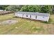 Spacious yard featuring a fire pit and single-story house with a well-maintained lawn at 5056 Red Oak Rd, Cottageville, SC 29435