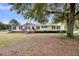 Inviting single-story home with classic design and a lush green yard at 5056 Red Oak Rd, Cottageville, SC 29435