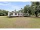 Attractive single-story home with a well-maintained lawn and inviting front entrance at 5056 Red Oak Rd, Cottageville, SC 29435
