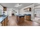 Eat-in kitchen with wood-look flooring, wood cabinets, and an island for food prep at 5056 Red Oak Rd, Cottageville, SC 29435