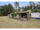 Open shed with ladder, ivy, and lawn mower inside at 5056 Red Oak Rd, Cottageville, SC 29435