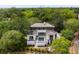 Stunning aerial view of a home, highlighting its private pool and lush surroundings near the Ravenel Bridge at 525 Old Bridge Ct, Mount Pleasant, SC 29464