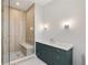 Bathroom with modern shower featuring a bench, and a spacious, dark-green vanity at 525 Old Bridge Ct, Mount Pleasant, SC 29464