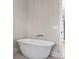 Bright bathroom with a standalone tub, a sleek faucet, and painted walls at 525 Old Bridge Ct, Mount Pleasant, SC 29464