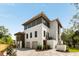 Elegant home featuring a brick exterior, two-car garage, and professionally designed landscaping at 525 Old Bridge Ct, Mount Pleasant, SC 29464