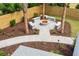 Outdoor fire pit area surrounded by custom seating, perfect for entertaining in a cozy setting at 525 Old Bridge Ct, Mount Pleasant, SC 29464