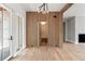 Hallway shows a hidden entry and wood accent wall, complemented by a hanging light fixture at 525 Old Bridge Ct, Mount Pleasant, SC 29464