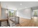 Open hallway with hardwood floors, and sleek metal railings at 525 Old Bridge Ct, Mount Pleasant, SC 29464