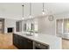 Spacious kitchen with an oversized island featuring a sink, stainless steel appliances, and modern pendant lighting at 525 Old Bridge Ct, Mount Pleasant, SC 29464