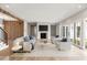 Bright and spacious living room featuring a cozy fireplace, wood beams, and modern furnishings at 525 Old Bridge Ct, Mount Pleasant, SC 29464