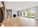 Bright living room with a fireplace, light floors, and sliding glass doors leading to the patio at 525 Old Bridge Ct, Mount Pleasant, SC 29464
