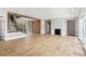 Spacious living room with hardwood floors, a fireplace, and an open staircase with iron railings at 525 Old Bridge Ct, Mount Pleasant, SC 29464