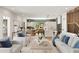 Open-concept living and kitchen area with hardwood floors, stylish decor, and abundant natural light at 525 Old Bridge Ct, Mount Pleasant, SC 29464