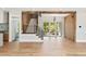 Expansive open-concept living area featuring hardwood floors, a staircase, and access to the outdoor pool at 525 Old Bridge Ct, Mount Pleasant, SC 29464