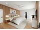 Serene main bedroom with a wood accent wall, minimalist decor, and plush bedding at 525 Old Bridge Ct, Mount Pleasant, SC 29464