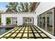 Impressive outdoor kitchen and dining space, adjacent to a pool and featuring a built-in grill at 525 Old Bridge Ct, Mount Pleasant, SC 29464