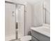 A modern bathroom with a walk-in shower, a single-sink vanity, and neutral tiling at 527 Verdi Drive Dr, Summerville, SC 29486