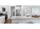 Modern kitchen features stainless steel appliances, white cabinets, and a spacious island with seating at 527 Verdi Drive Dr, Summerville, SC 29486