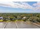 Aerial view of waterfront homes and docks surrounded by lush trees at 528 Wampler Dr, Charleston, SC 29412