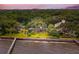 Stunning aerial view of waterfront homes surrounded by lush trees, featuring a private dock and serene waterfront at 528 Wampler Dr, Charleston, SC 29412