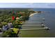 Waterfront aerial view showing the mature landscaping, private beach and pier at 528 Wampler Dr, Charleston, SC 29412
