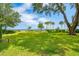 Large backyard with mature trees and views of the waterfront at 528 Wampler Dr, Charleston, SC 29412