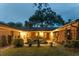 Private brick courtyard with lush greenery and charming outdoor space at twilight at 528 Wampler Dr, Charleston, SC 29412